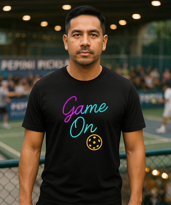 Man wearing a black t-shirt with 'Game On' text on a sports court background